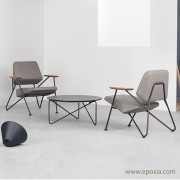 Fauteuil design Polygon, pieds noirs assise tissu gris